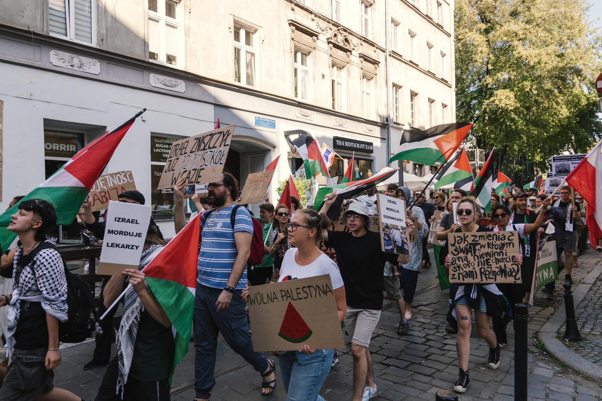 Protesters marching through a side street in the Old Town.